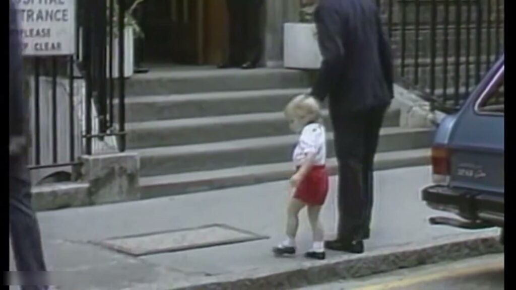 A boy on a London street, early morning